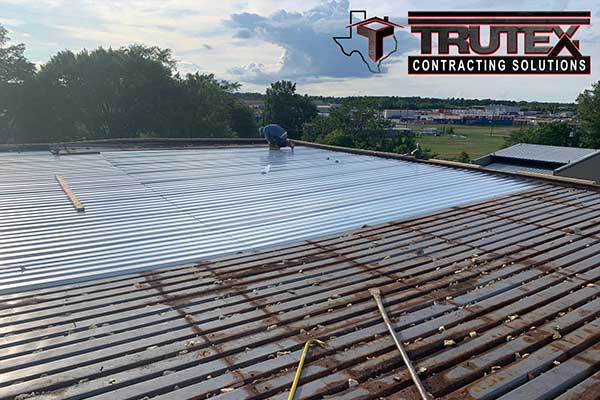 Trutex working installing a new metal roof on a flat commercial roof