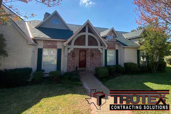 Residential home with new gray shingles installed by Trutex